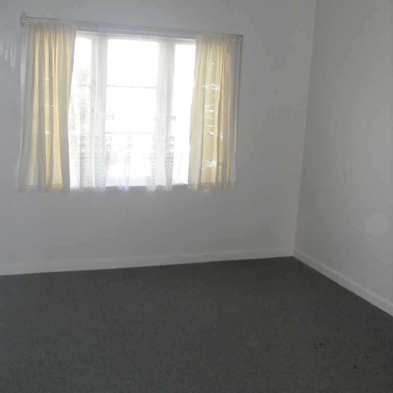 This is a tidy, character three bedroom upstairs unit with all original fittings. - Photo 1