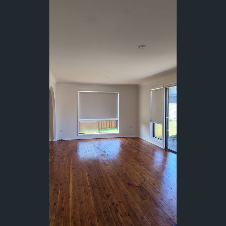 Family Home in Convenient Killarney Vale Location - Photo 1