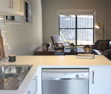 An inviting beautifully presented 3‑bedroom townhouse located in th... - Photo 1