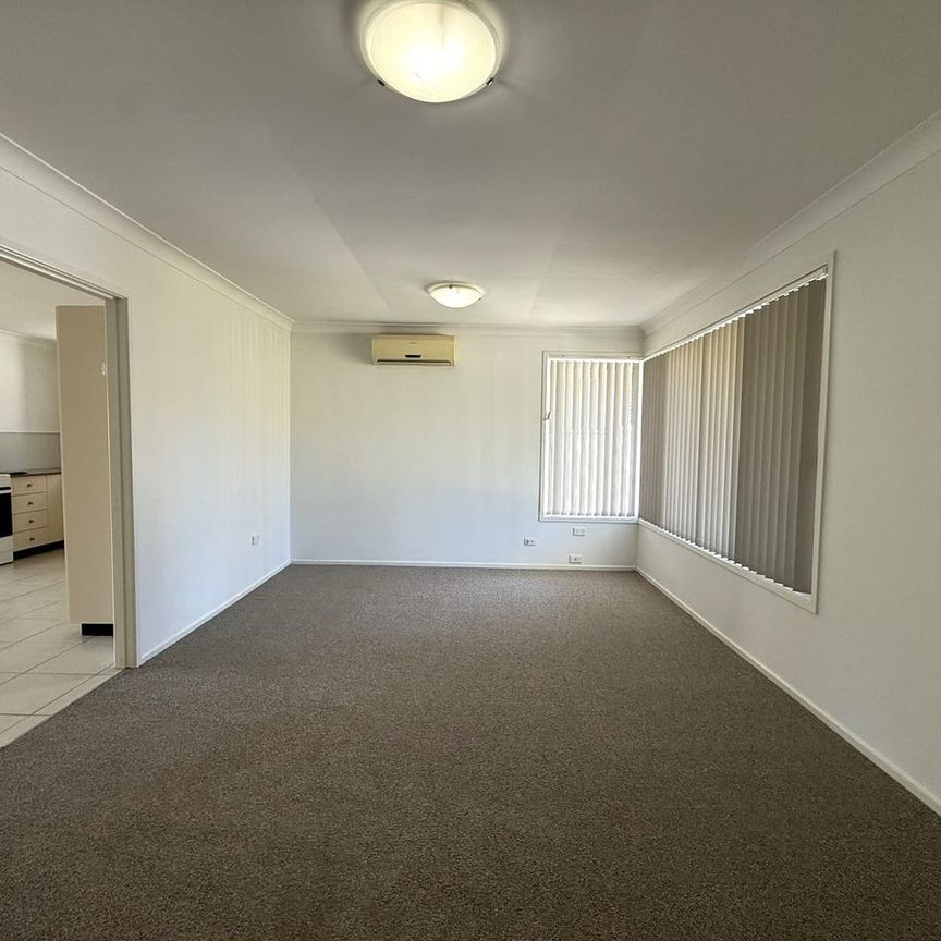 Easy Care Home - Photo 1