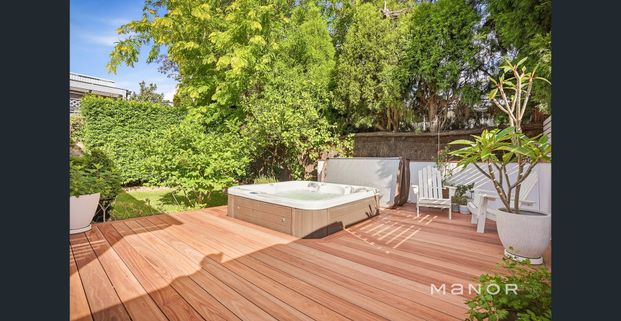 Stylish Family Home with Spa, Modern Comforts & Drive-Through Garage! - Photo 1