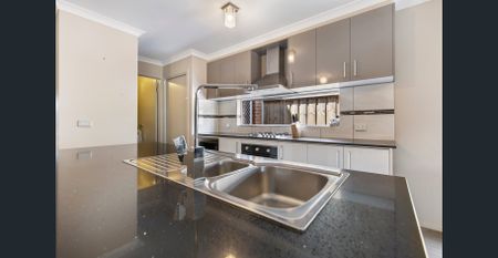 FAMILY HOME IN EXTREME PROXIMITY TO TRAIN STATION! - Photo 5