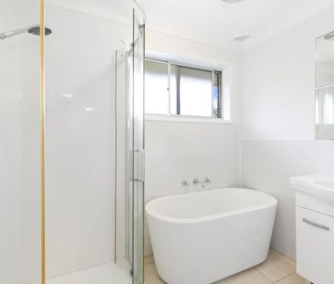 Freshly Updated Family Home with Sunroom & Covered Deck - Photo 4