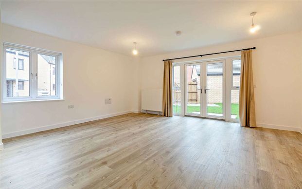 A four bedroom detached family home with a garage and garden - Photo 1