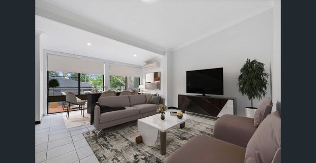 GREAT FAMILY HOME IN AN ULTRA CONVENIENT LOCATION WITH LAWN MAINTENANCE INCLUDED - Photo 1