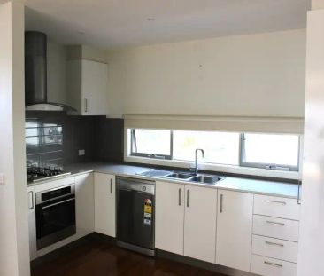 “Bright, Fresh, Stunning Townhouse with Open Plan living!” - Photo 6