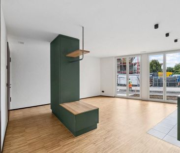 Attraktive und charmante Neubauwohnung mit Sitzplatz an bester Lage - Foto 1