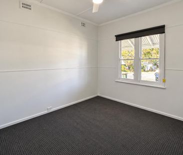Charming Three-Bedroom Home, Beautifully Refreshed Throughout - Photo 6