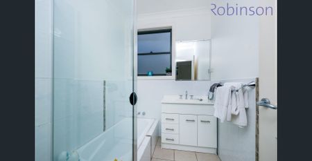 Two-bedroom townhouse offers modern living in a convenient and low-maintenance setting - Photo 5