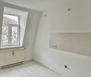 Raffiniert wohnen unterm Dach! - Foto 1