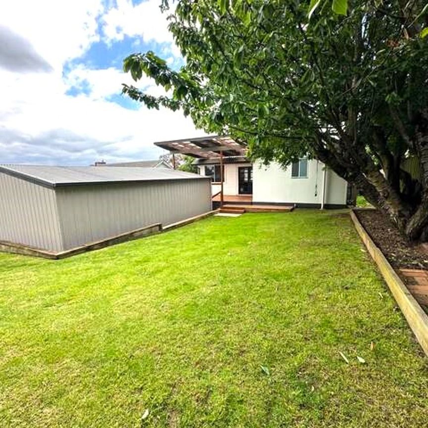 COSY FAMILY HOME PACKED WITH FEATURES! - Photo 1