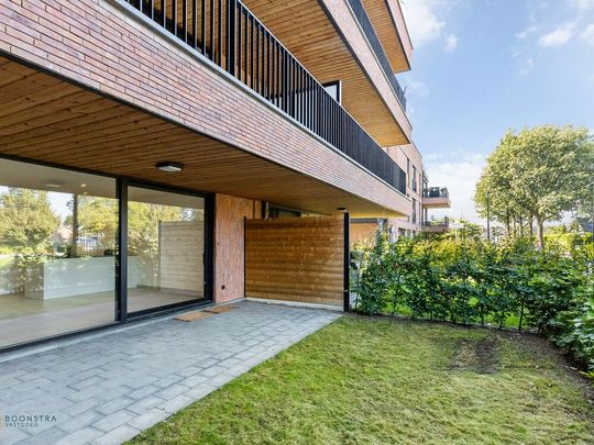 Gelijkvloers en energiezuinig appartement met 2 slpkrs en gezellig tuintje in Koningshooikt - Photo 1