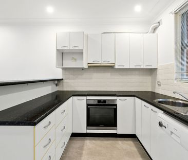 Dual-Level Townhouse In An Ideal Location - Photo 1