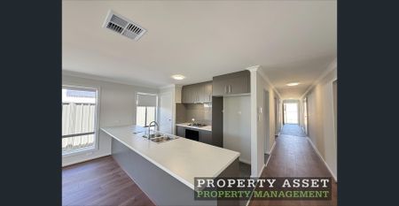 Modern Three-Bedroom Home in a Quiet Hills Location with SOLAR and Second Living Area - Photo 4