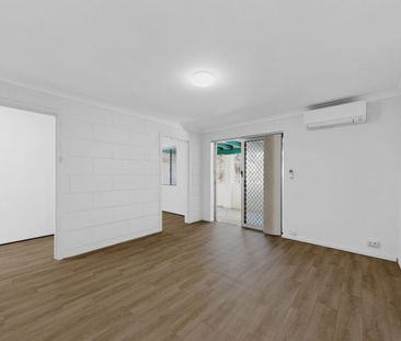 Renovated 1-Bedroom + Study Apartment with Ocean Glimpses - Photo 2