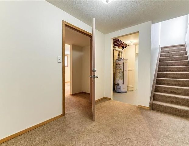 Basement suite with 1 bedroom, 1 full bath, and a kitchenette area | 79 Abalone Way Northeast, Calgary - Photo 1