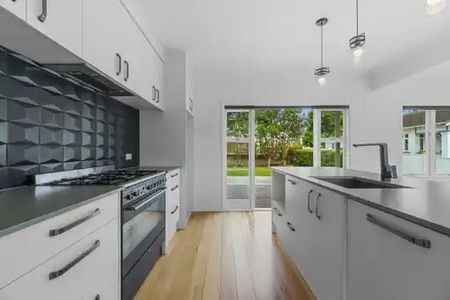 This beautifully presented three-bedroom, two-bathroom home offers a premium standard of living in one of the most desirable locations near the city. - Photo 3