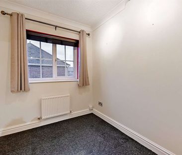 A modern three bedroom home with garage and off-street parking in a... - Photo 6