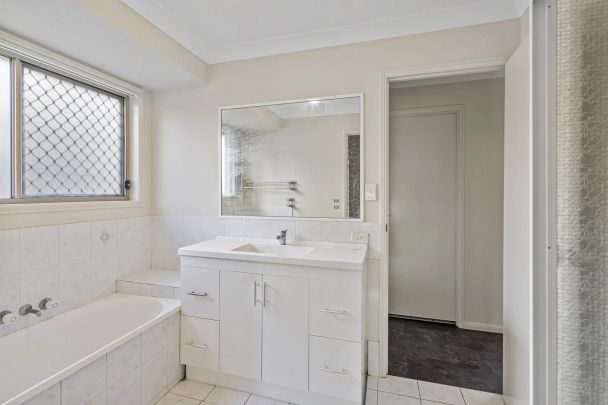 Four bedroom home with air conditioning on large block.. - Photo 1