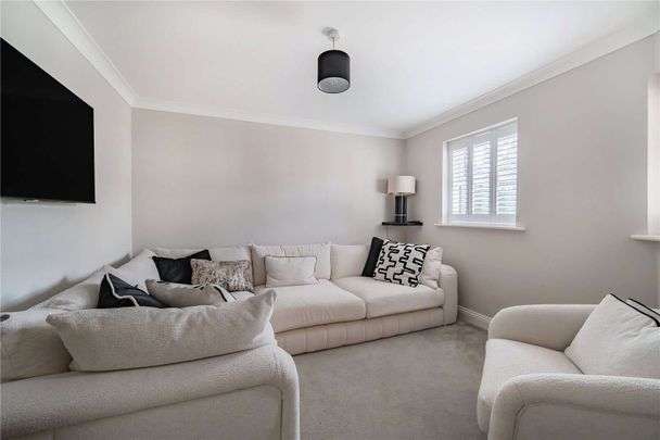 An immaculately presented four-bedroom detached family home with garaging. - Photo 1