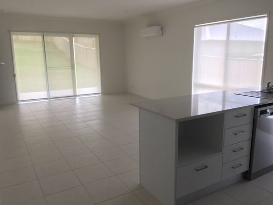 Family Home in Coomera Springs with Several Living Areas and Large Yard - Photo 1
