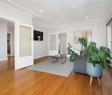 TASTEFULLY RENOVATED THREE BEDROOM HOME - Photo 2