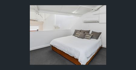 Top-Floor Loft Living with Timeless Industrial Charm - Photo 2