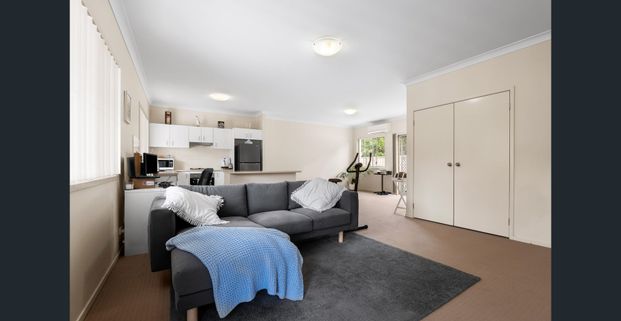 Nestled in a peaceful complex, this delightful two-bedroom unit offers comfort and convenience - Photo 1