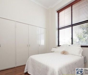 Stunning tri-level townhouse in historic warehouse conversion - Photo 5