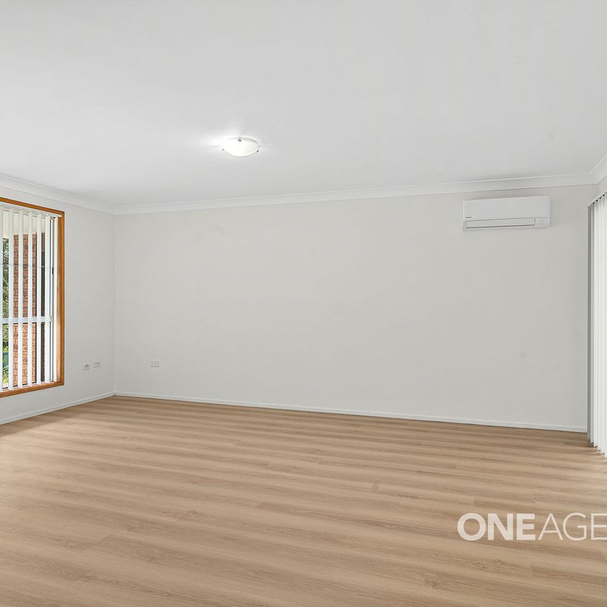 SPACIOUS THREE-BEDROOM HOME WITH LARGE ENTERTAINING AREA AND CLOSE TO THE WATER - Photo 1