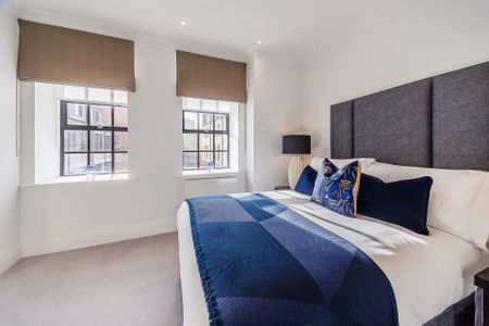 An exclusive loft apartment located in a converted warehouse development overlooking the River Thames. - Photo 3