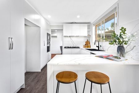 RENOVATED AND READY TO MOVE IN Three Bedroom Residence Close to All Amenities! - Photo 2