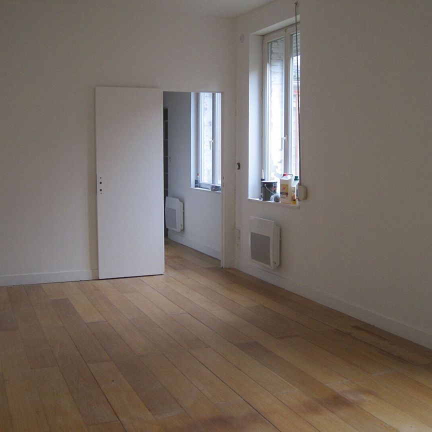 A LOUER APPARTEMENT CENTRE VILLE EN RDC A ST QUENTIN 02100 - Photo 1