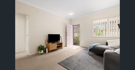 Nestled in a peaceful complex, this delightful two-bedroom unit offers comfort and convenience - Photo 5