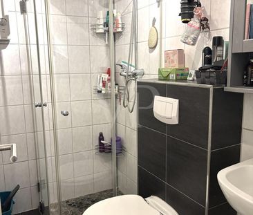 Gepflegte 2-Zimmer-Wohnung mit Einbauküche in zentraler Lage - Foto 6