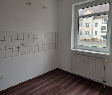 Gemütliche 2 Raumwohnung im Erdgeschoss mit Balkon ab 1. Januar 202... - Foto 1