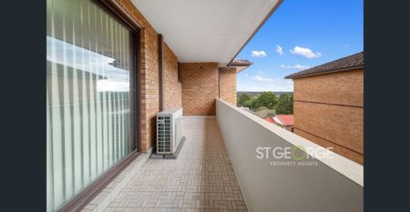 Convenient Two Bedroom Apartment Enjoying District Views - Photo 5