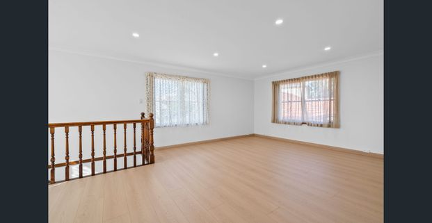 Expansive Five-Bedroom Home with Large Backyard - Photo 1
