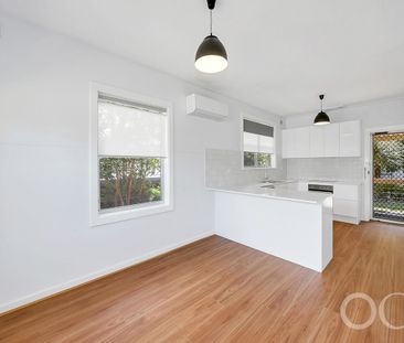 Open the door to coastal living with a sunlit deck retreat - Photo 1