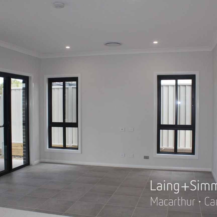 Brand New - 4 Bedroom + Multiple Living Areas + Large Yard - Photo 1