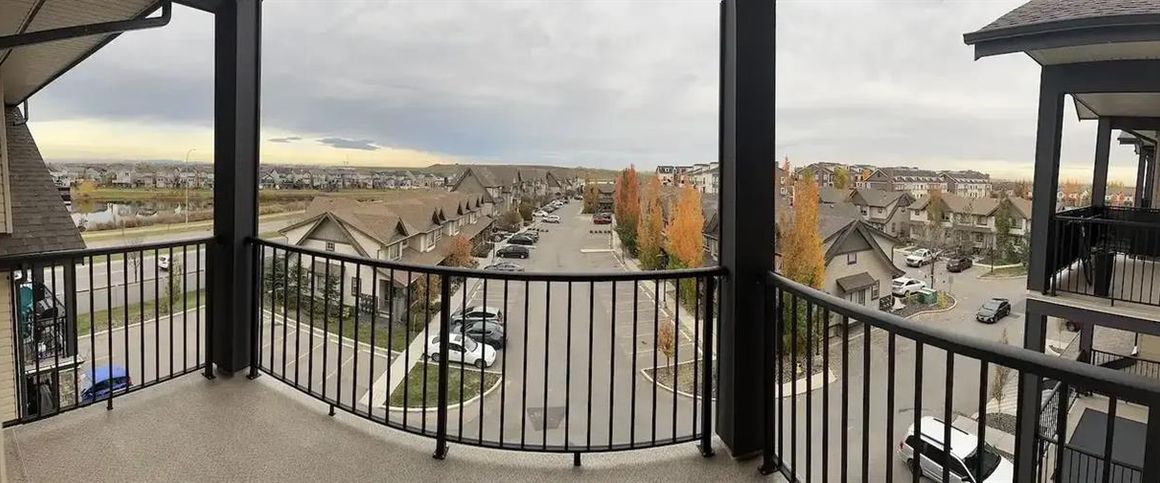 Top Floor 1 Bedroom + 1 Den Condo Unit | 420 - 117 Copperpond Common South East, Calgary - Photo 1