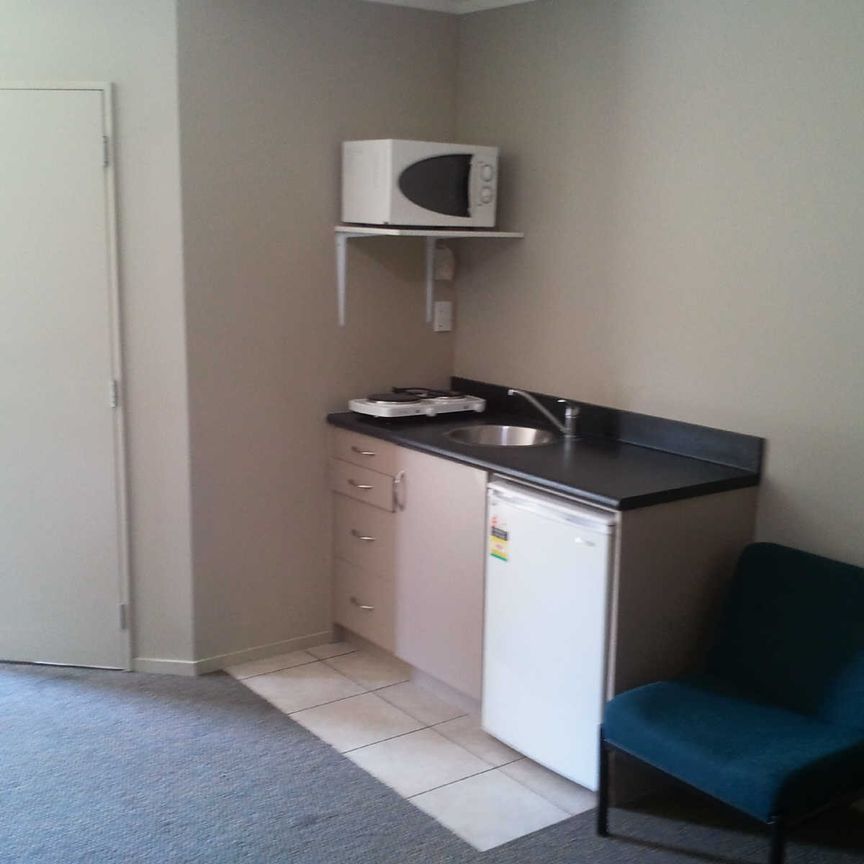 This large self contained studio room wont last long. - Photo 1