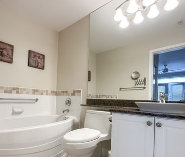 2 Bed + Den Condo | Steveston Village | Pond View • Parking - Photo 1