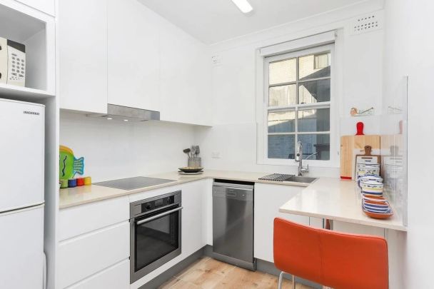 SITUATED AT THE REAR OF BUILDING - RENOVATED BEACHSIDE ABODE - Photo 1