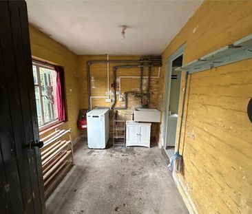 A three-bedroom semi-detached cottage located in the village of Lla... - Photo 6