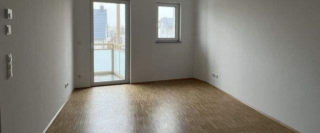 Gemütliche und hochwertige Neubauwohnung mit Balkon, EBK und Fußbodenheizung! - Photo 1