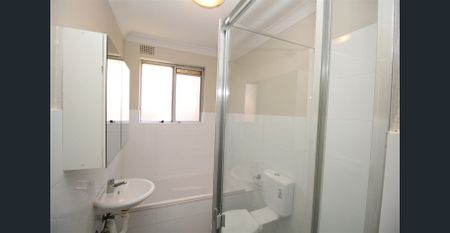 ONE WEEKS RENT FREE - MOVE IN BEFORE XMAS - TOP FLOOR TWO BEDROOM UNIT WITH GARAGE - Photo 5