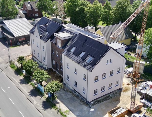 Ein architektonisches Highlight: Wohnen im historischen Schulgebäude mit modernster Technik! - Photo 1