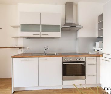 Ebenerdige 2,5-Zimmer-Wohnung mit Eigengarten und moderner Einbaukü... - Foto 2