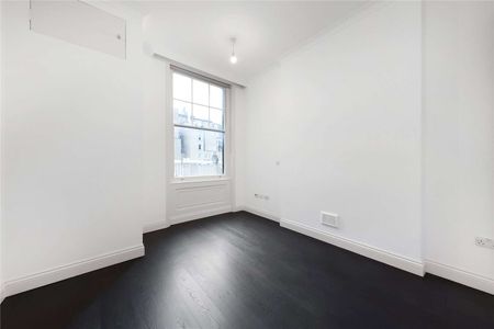 A first floor one bedroom apartment in a recently refurbished building benefitting from a generous reception room with 3.5m high ceilings, lift access and wooden flooring throughout. - Photo 5